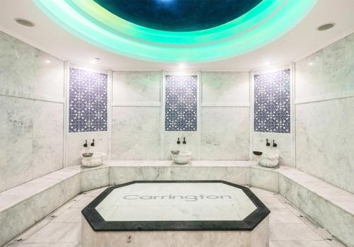 a bathroom with two sinks in a room with a ceiling at Sunny, big pool, garden-roof terrace view Cornervilla on area Kyrenia-Bahceli North-Cyprus in Bahçeli