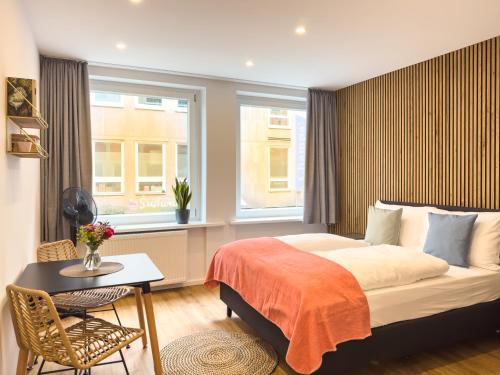 Ένα ή περισσότερα κρεβάτια σε δωμάτιο στο Lorenz Apartments