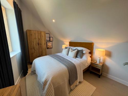 a bedroom with a bed with pillows on it at Chi An Treth in Hayle