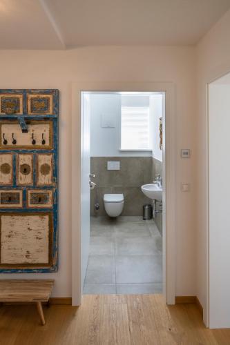 a bathroom with a toilet and a sink at Geierkogel Retreat in Hohentauern