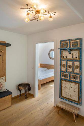 a room with a mirror and a room with a bed at Geierkogel Retreat in Hohentauern