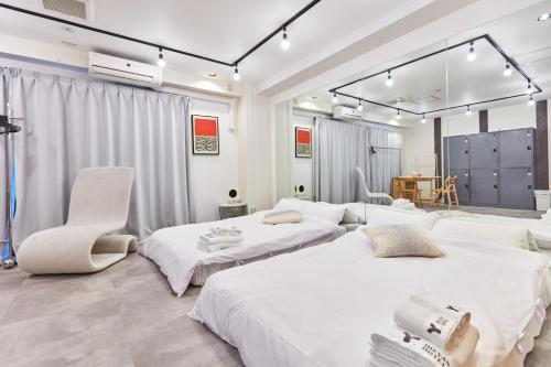 Postel nebo postele na pokoji v ubytování Tora Hotel Asakusa