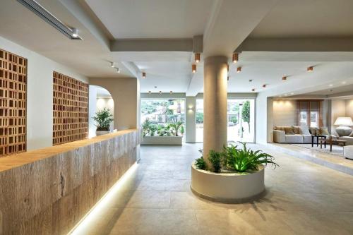 a lobby of a house with plants in it at Vasia Sea Retreat in Sissi