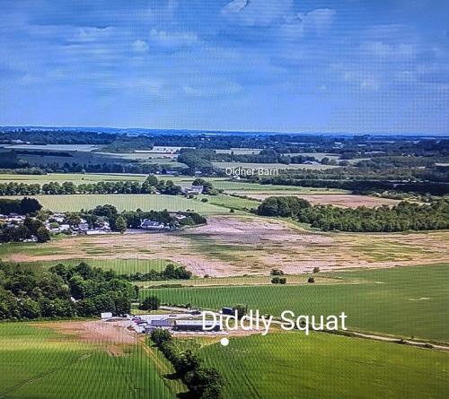 an aerial view of a green field with the words bubbey squat at Romantic Barn, Private Hot-Tub near Diddly Squat 2 or 3 night stays in Chipping Norton
