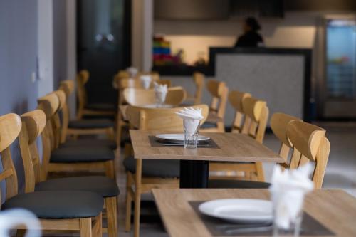 a row of tables and chairs in a restaurant at NatalieLe's Homestay in Phu Quoc