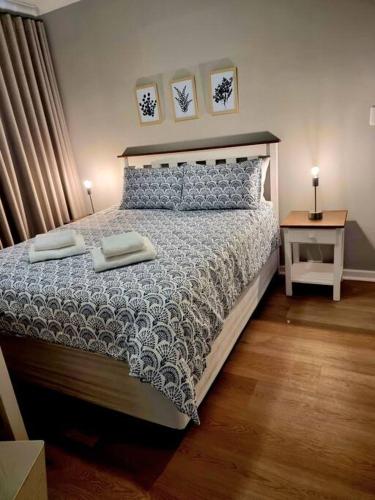 a bedroom with a bed with two towels on it at 20 Brandersig in Jeffreys Bay