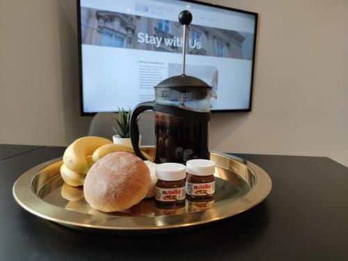 a tray of food on a table with a plate of food at City Centre Premier Executive Apartments in Sunderland