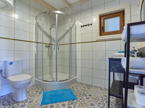 a bathroom with a shower and a toilet at Cottage in Niechorze near Baltic Sea Beach in Niechorze