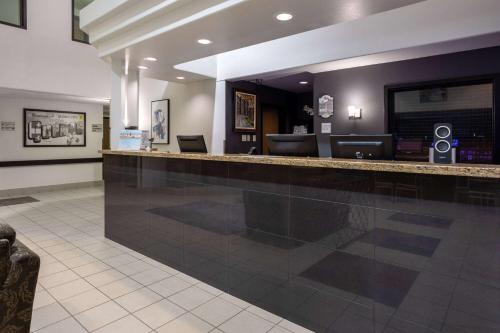 a swimming pool bar in a hotel lobby at Super 8 by Wyndham Quebec City in Quebec City