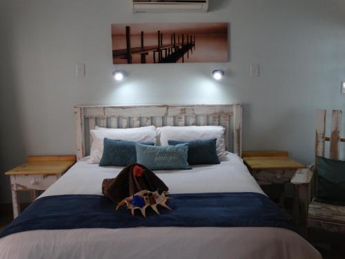 Ένα ή περισσότερα κρεβάτια σε δωμάτιο στο Isle La Breeze Guest House