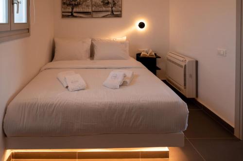 Ένα ή περισσότερα κρεβάτια σε δωμάτιο στο G & W Suites