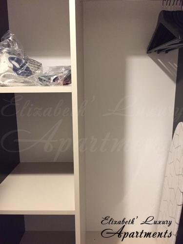 a closet with a white shelving unit at Beachfront Luxury Apartments Elizabeth, Pomorie in Pomorie