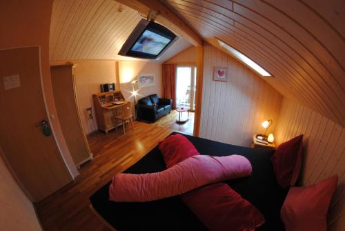 an overhead view of a living room with a couch at Chalet Hotel Adler in Kandersteg