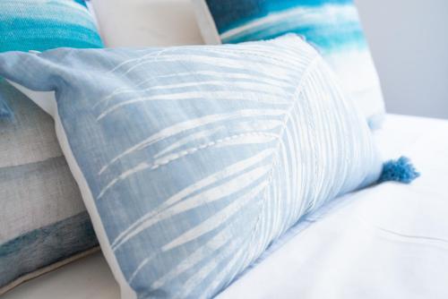 a pillow sitting on top of a bed at The Olive Garden-Almyrida in Almirida