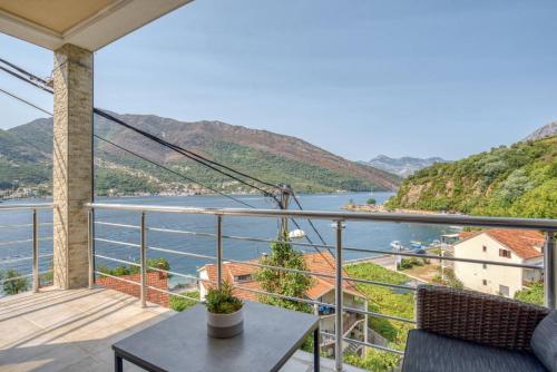 a balcony with a view of the water at Apartmani Nikic -Tivat in Tivat
