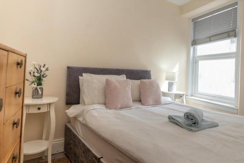 a bedroom with a bed with a mask on it at Belmont Villa in Ilfracombe