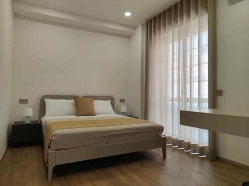 Letto o letti in una camera di Rosa Rooms Pompei