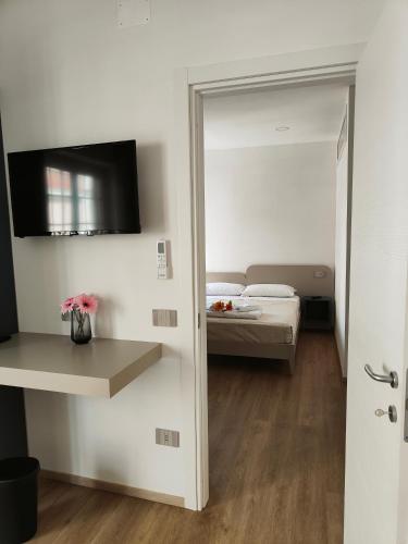 Letto o letti in una camera di Rosa Rooms Pompei