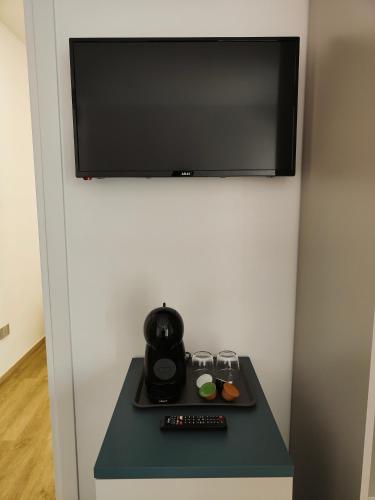 TV o dispositivi per l'intrattenimento presso Rosa Rooms Pompei