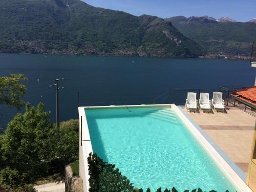 a swimming pool with a view of a body of water at Residence Dorio in Dorio