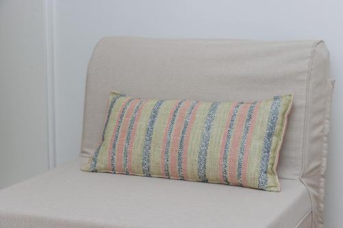 a pillow sitting on the back of a chair at Artina in Marathopolis
