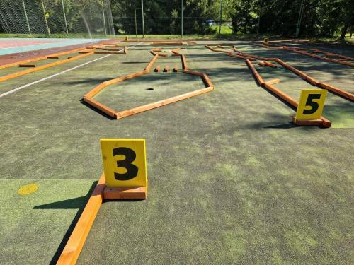 a parking lot with a bunch of ramps and numbers at Nykščio Namai & SPA in Anykščiai