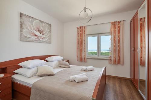 Postel nebo postele na pokoji v ubytování Apartment Villa Ma&Lu