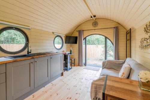 a kitchen and living room in a tiny house at Laburnum Farm Estate in Alderton