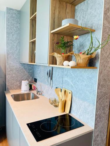 a kitchen with a sink and a counter top at C Tower Premium Apartments, Panoramic Sea View in Netanya