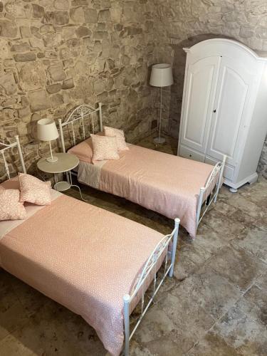 Postel nebo postele na pokoji v ubytování Dimora martina