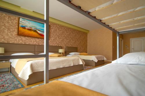 Postel nebo postele na pokoji v ubytování NBT Hotel Reps