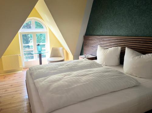 Voodi või voodid majutusasutuse Stuckhotel Fettehenne toas