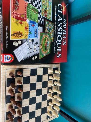 a board game and a boardgame on a wall at Duplex By Aurelle 2 in Schiltigheim