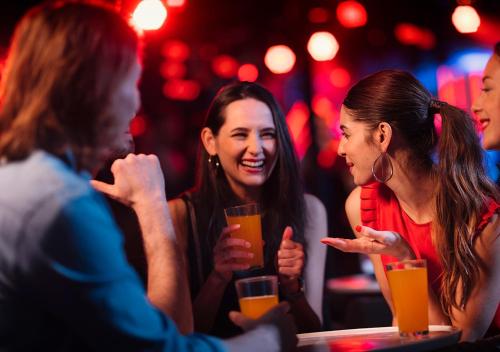 a group of women sitting at a table in a bar at Viking Line ferry Viking Cinderella - One-way journey from Stockholm to Helsinki in Stockholm