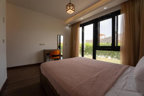 Ένα ή περισσότερα κρεβάτια σε δωμάτιο στο Stayr Somabay - Bay Life Home Rentals
