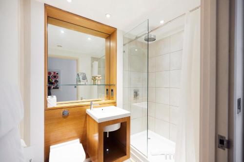 a bathroom with a sink and a shower at The Jasper Walk Escape - Charming 2BDR Flat with Balcony in London