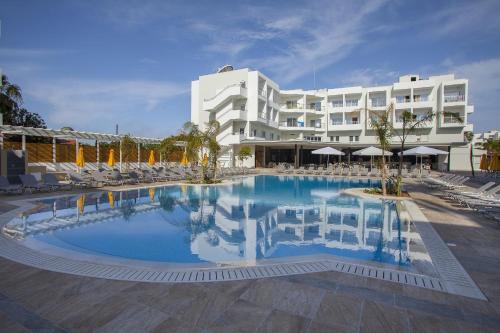 a large swimming pool in front of a hotel at Mayfair Hotel in Paphos City