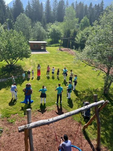a group of people playing a game in a field at Aldiana Club Salzkammergut und GrimmingTherme in Bad Mitterndorf