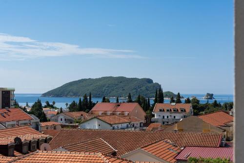 a view of a town with red roofs at Marea Apartments Budva in Budva