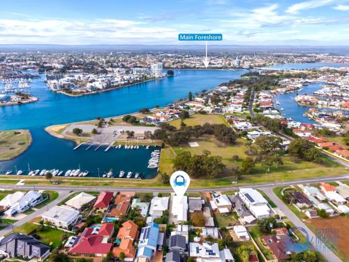 an aerial view of a city with a harbor at Water Lovers Haven in Mandurah in Mandurah