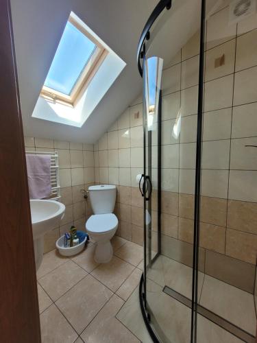 a bathroom with a shower and a toilet at U Gacka in Władysławowo