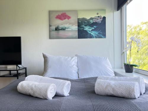 a bedroom with a bed with two pillows on it at Studio Apartment In Rdovre in Rødovre