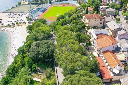 an overhead view of a beach with a baseball field at Ribica Luxury Rooms in Rijeka