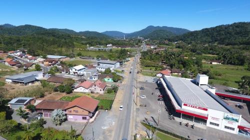 an aerial view of a town with a bus on a street at Kamke's Haus III in Pomerode