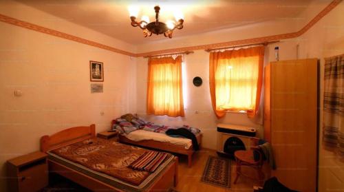 Postel nebo postele na pokoji v ubytování Tornácos Vendégház - Kismarja
