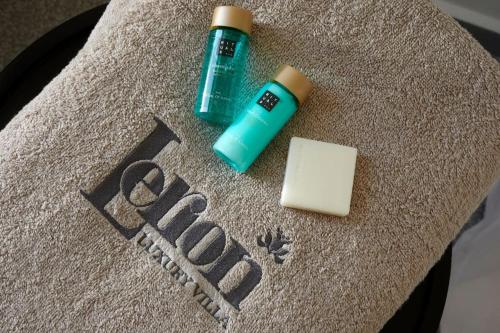 a bottle of mouthwash and a bar of soap and a stick of butter at Lerion Luxury Villas in Akrotiri