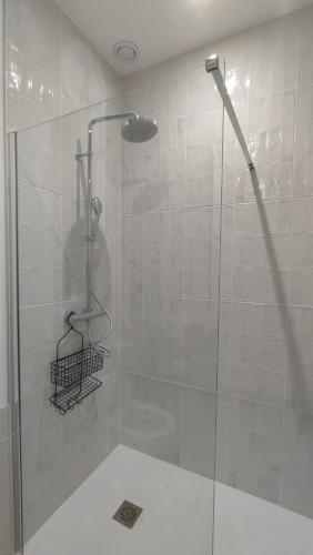 a shower with a glass door in a bathroom at Bohemia - T2 Design avec Terrasse proche de Cassis in Roquefort-la-Bédoule