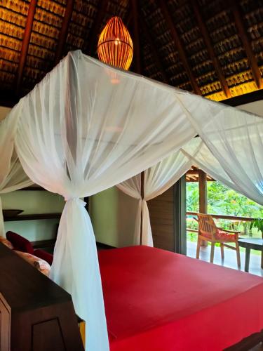 Katil atau katil-katil dalam bilik di Pousada Boutique Sitio das Jaqueiras-Vista Rio Mar