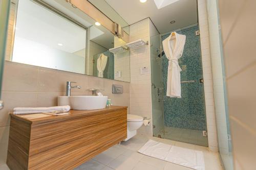 a bathroom with a sink and a shower at Boho Boutique Hotel Amman in Amman