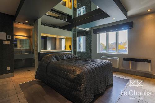 Hotel Le Chablis Cadillacにあるベッド
